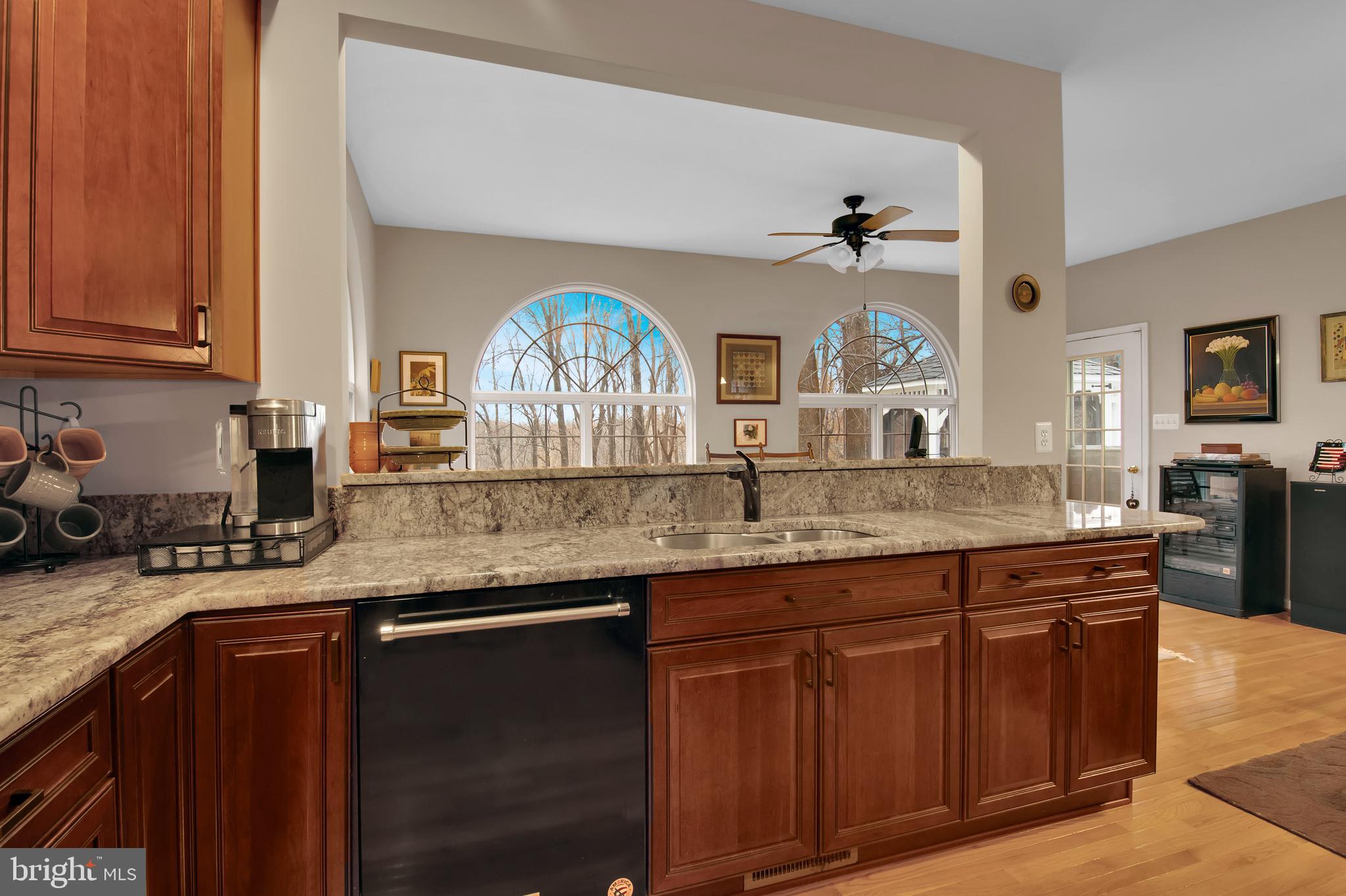 5534 Nutwell Sudley Road Deale, MD 20751 - Photo 20 of 51 a kitchen with granite countertop a sink and cabinets