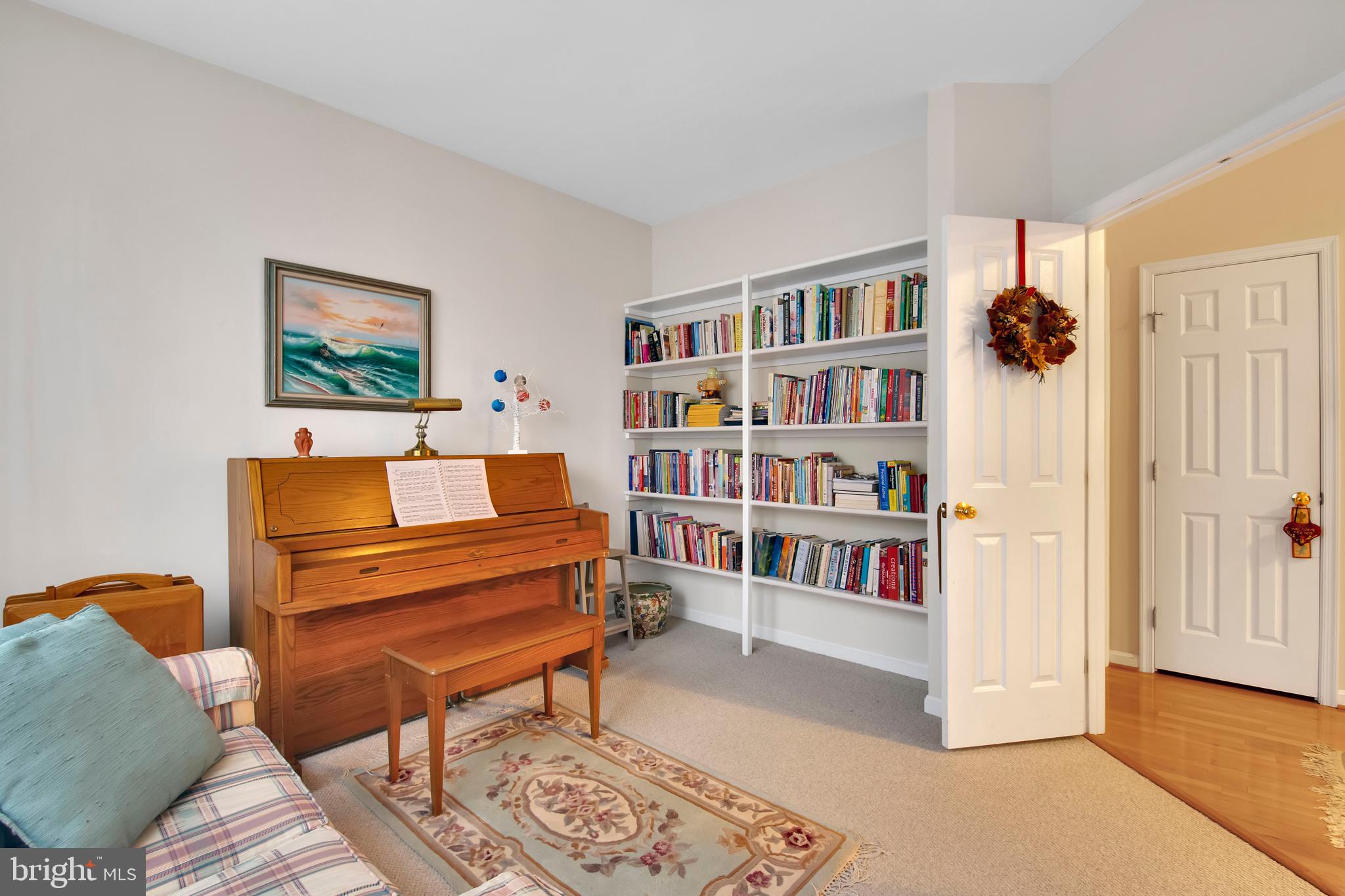 5534 Nutwell Sudley Road Deale, MD 20751 - Photo 22 of 51 a living room with furniture and a book shelf
