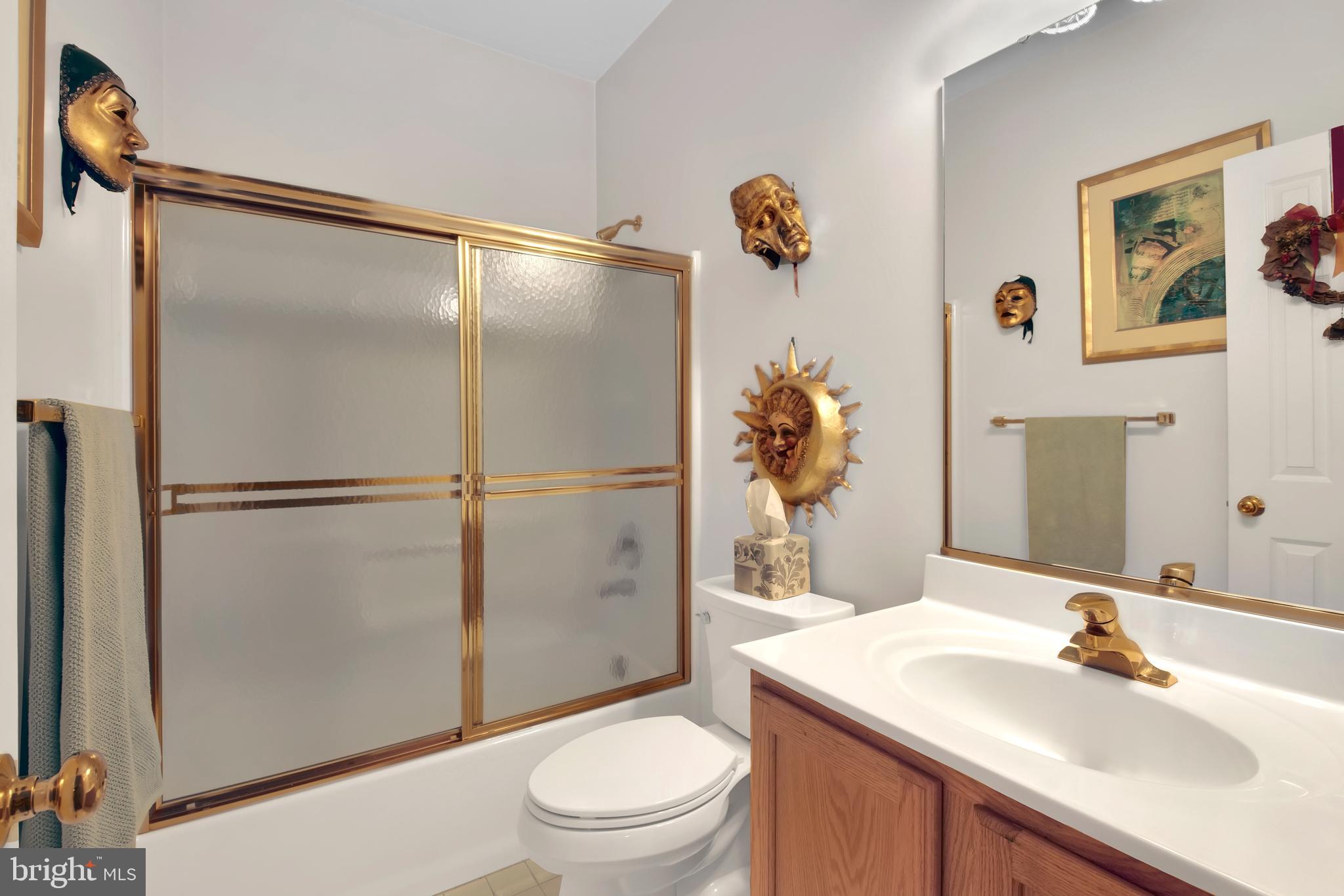 5534 Nutwell Sudley Road Deale, MD 20751 - Photo 23 of 51 a bathroom with a sink toilet and shower