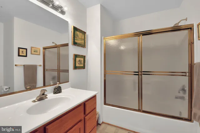 a bathroom with a sink and mirror