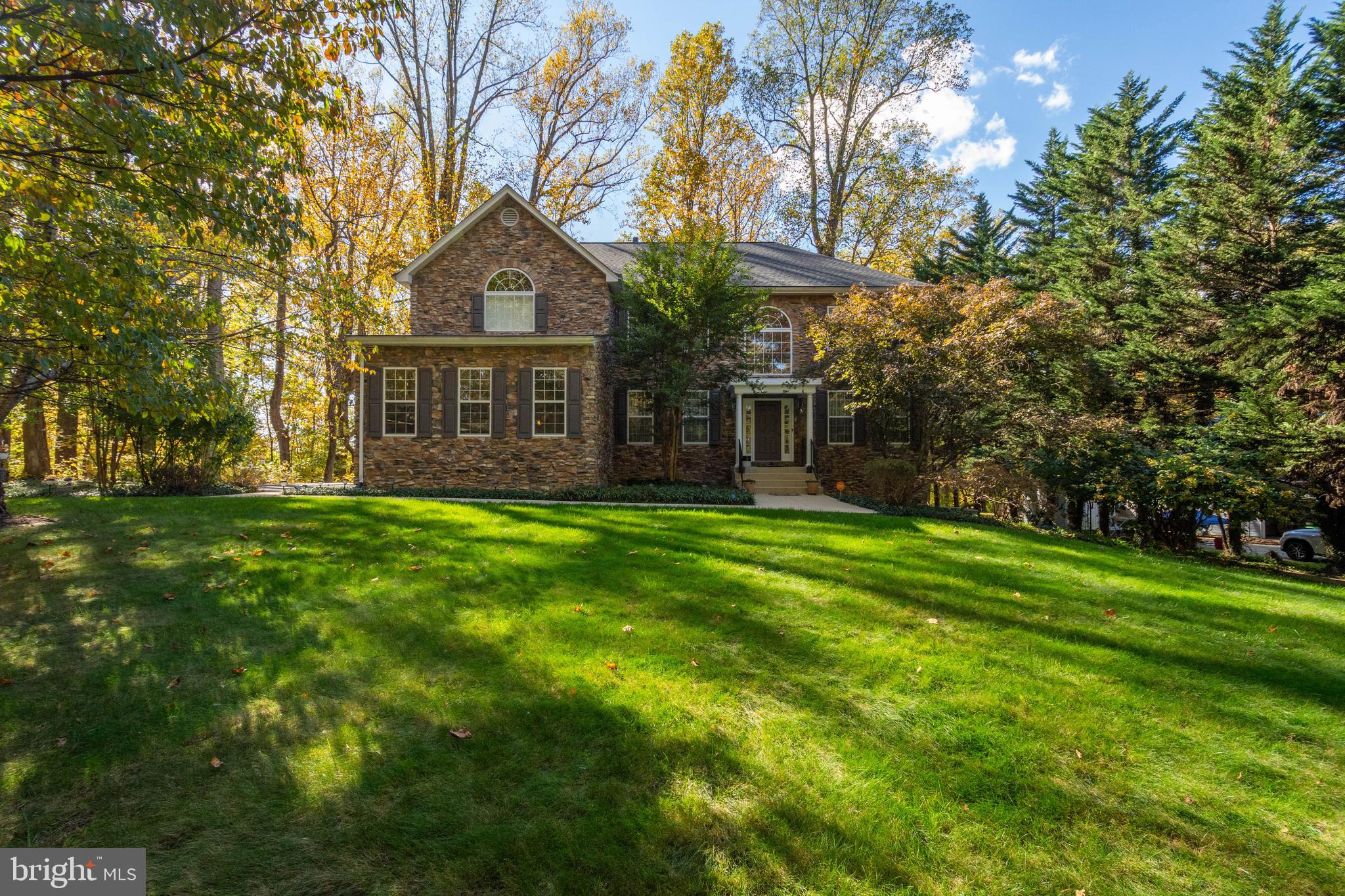 5534 Nutwell Sudley Road Deale, MD 20751 - Photo 5 of 51 a view of a big house with a big yard and large trees