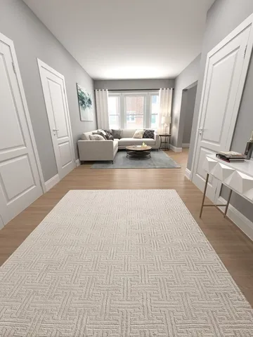 a large white bed in a large room with a large window