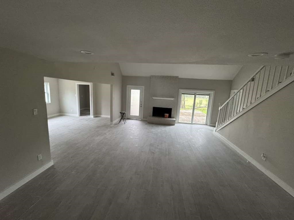 529 Brandon Road Conroe, TX 77302 - Photo 2 of 13 a view of empty room with a fireplace