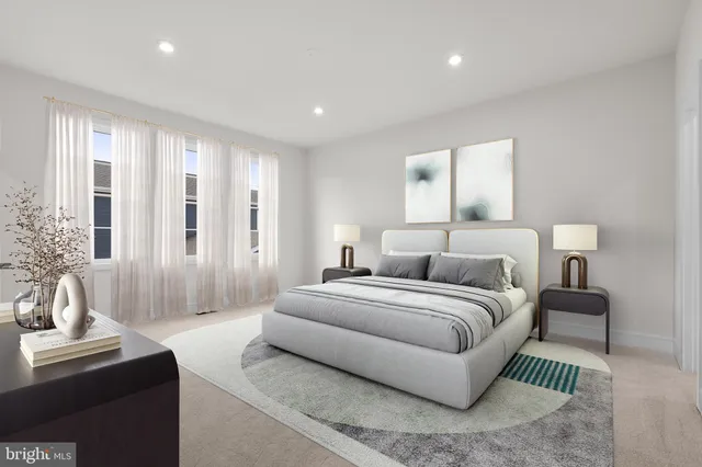 a spacious bedroom with a bed and a couch