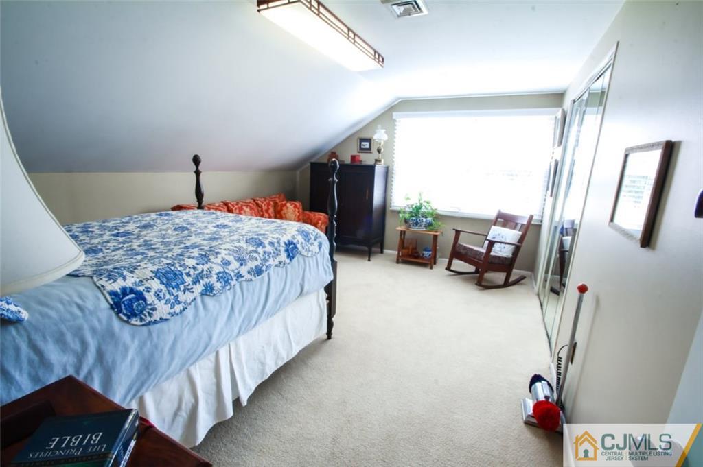 32 Summerall Road Somerset, NJ 08873 - Photo 12 of 17 a bedroom with a bed and a couch
