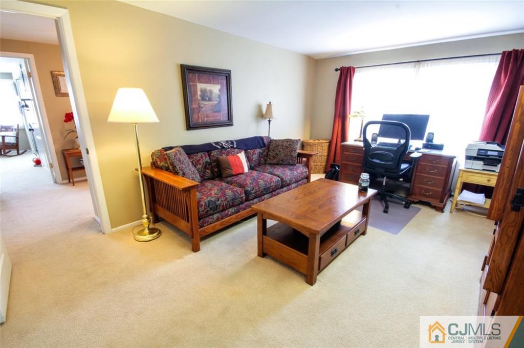 32 Summerall Road Somerset, NJ 08873 - Photo 13 of 17 a living room with furniture and a lamp