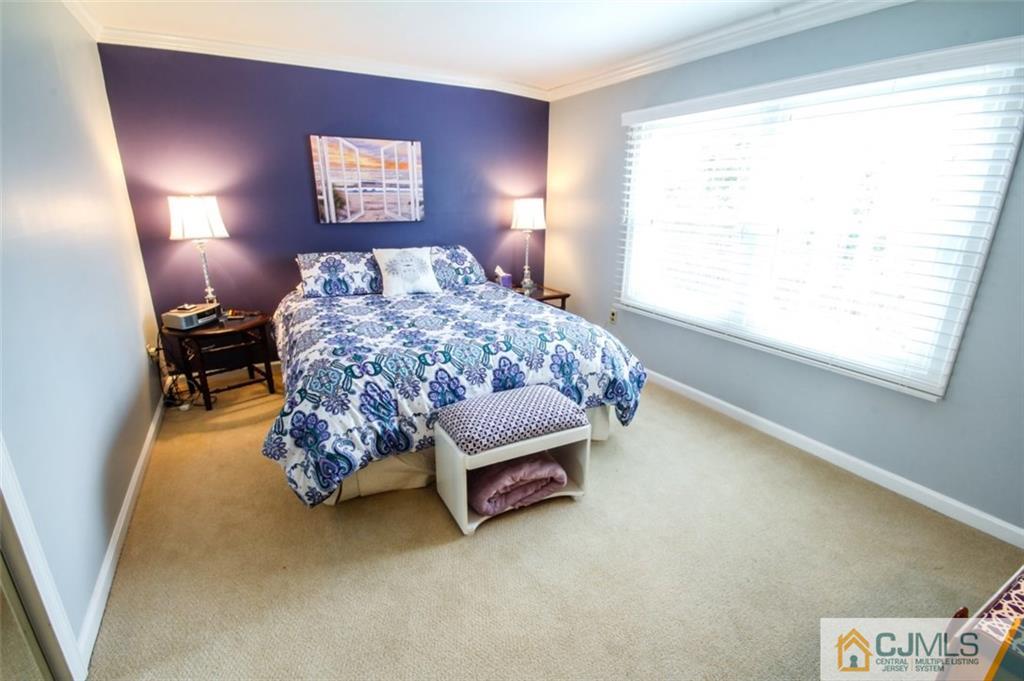 32 Summerall Road Somerset, NJ 08873 - Photo 15 of 17 a bed sitting in a bedroom next to a window