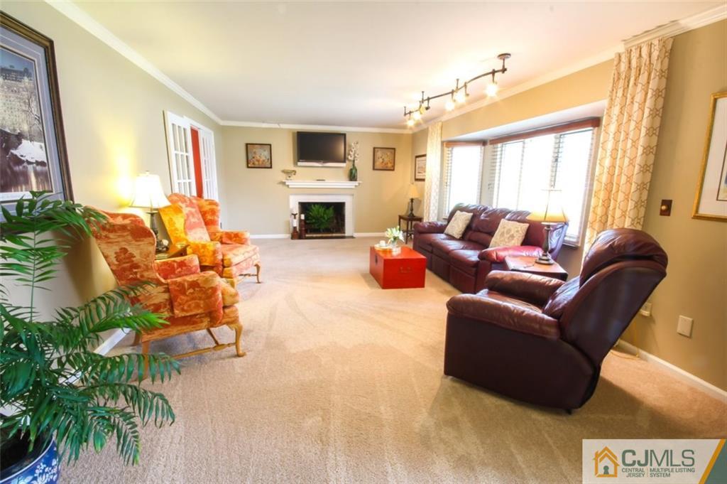 32 Summerall Road Somerset, NJ 08873 - Photo 4 of 17 a living room with furniture fireplace and a large window