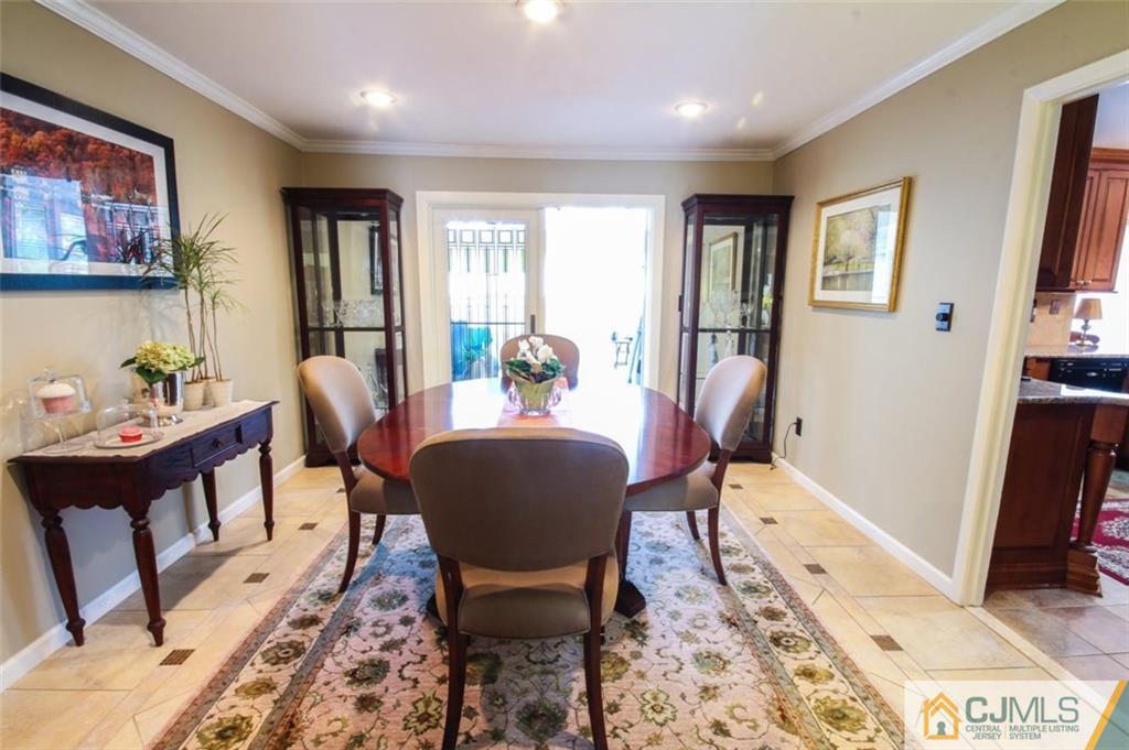 32 Summerall Road Somerset, NJ 08873 - Photo 5 of 17 a dining room with furniture a rug and wooden floor