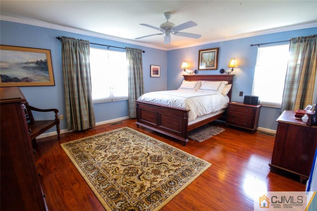 32 Summerall Road Somerset, NJ 08873 - Photo 8 of 17 a bed sitting in a bedroom next to a window