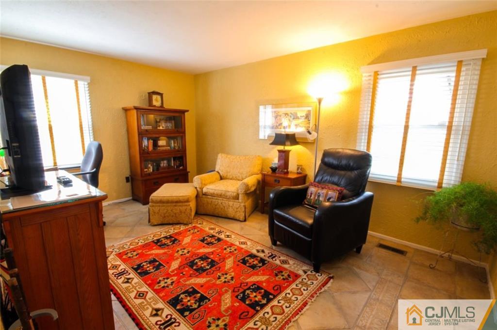 32 Summerall Road Somerset, NJ 08873 - Photo 10 of 17 a living room with furniture and a flat screen tv