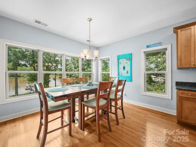 a view of a dining room with furniture window and outside view