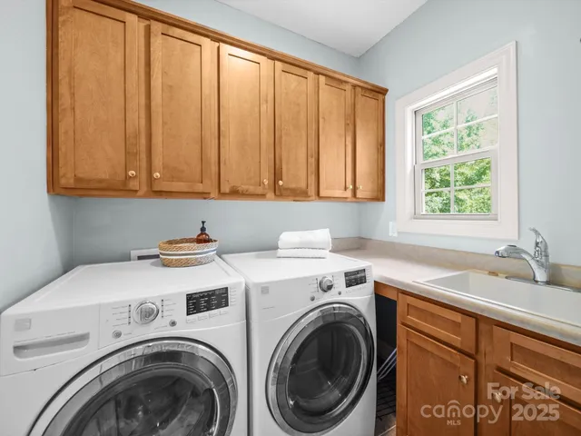 a bedroom with a large bed and a large window