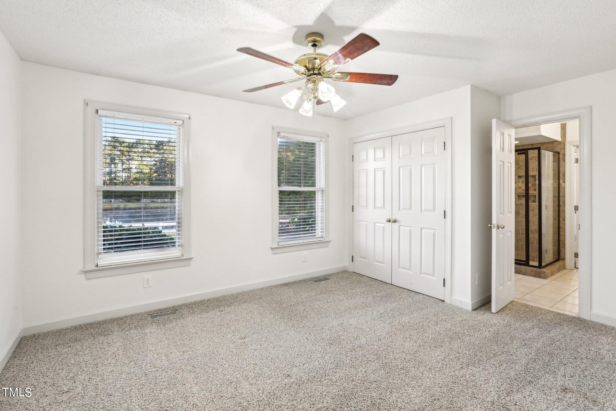 1517 Crickett Road Raleigh, NC 27610 - Photo 15 of 41 a view of an empty room with a window
