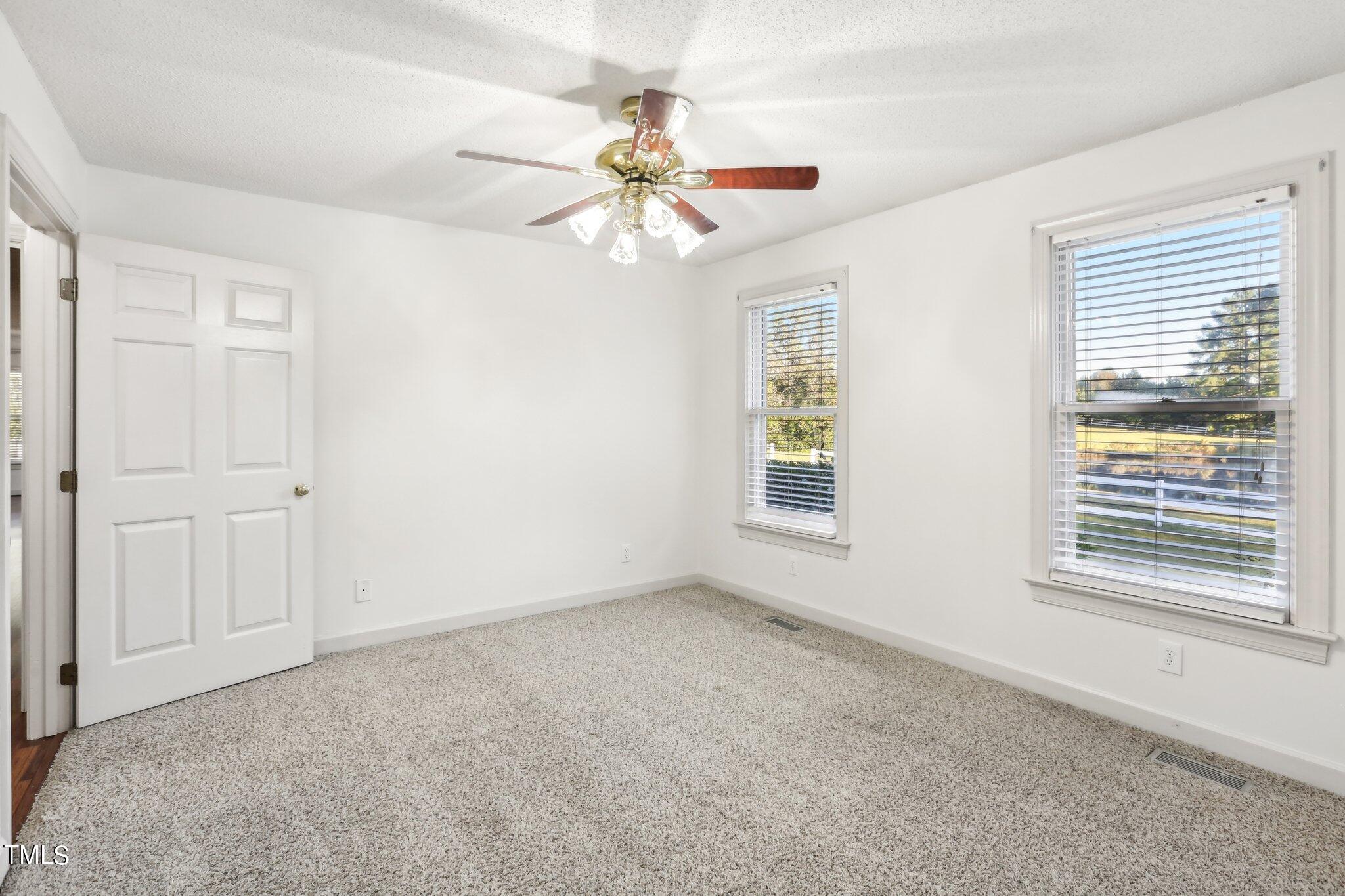 1517 Crickett Road Raleigh, NC 27610 - Photo 17 of 41 a view of an empty room with a window
