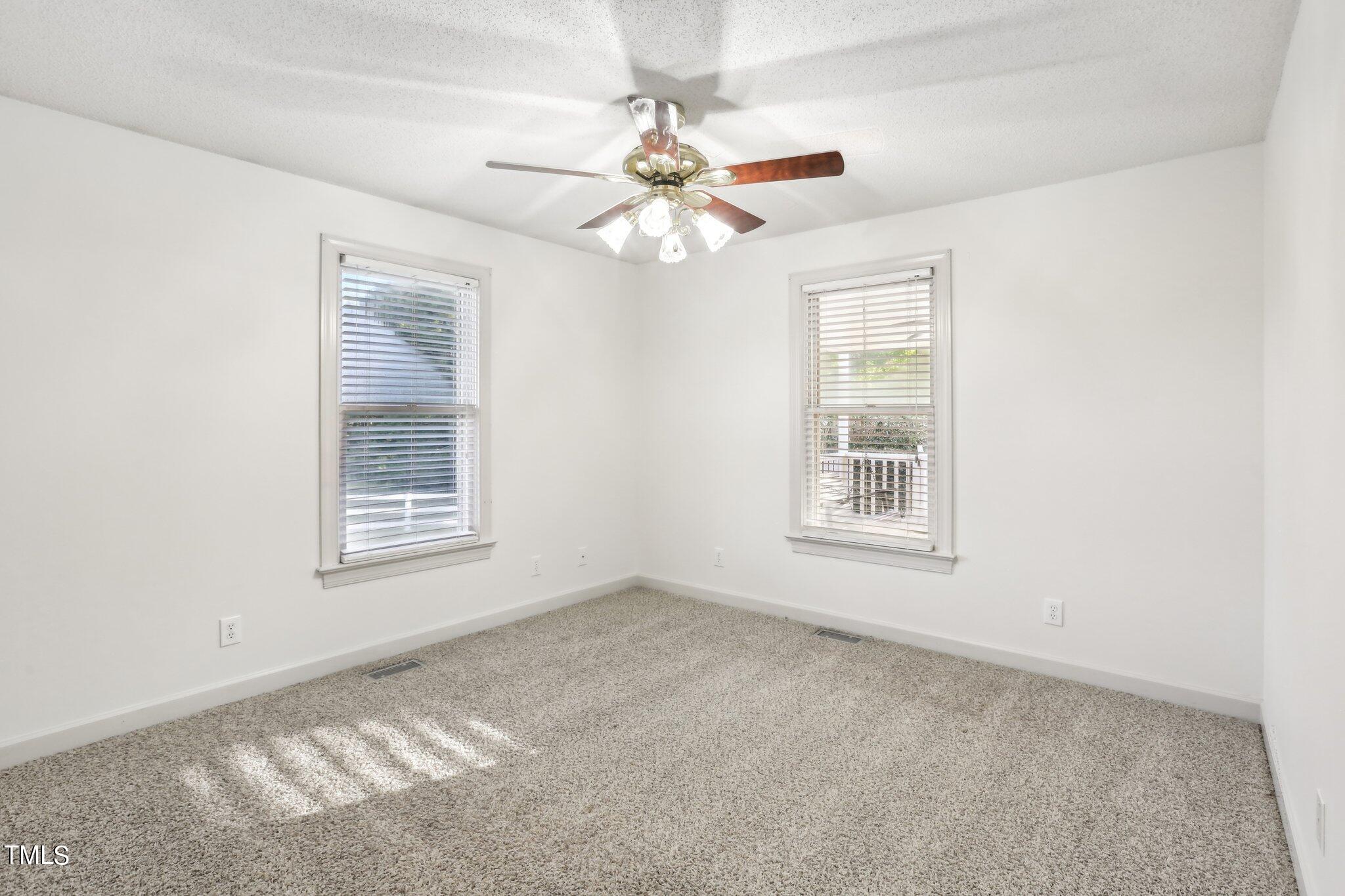 1517 Crickett Road Raleigh, NC 27610 - Photo 20 of 41 a view of an empty room with a window