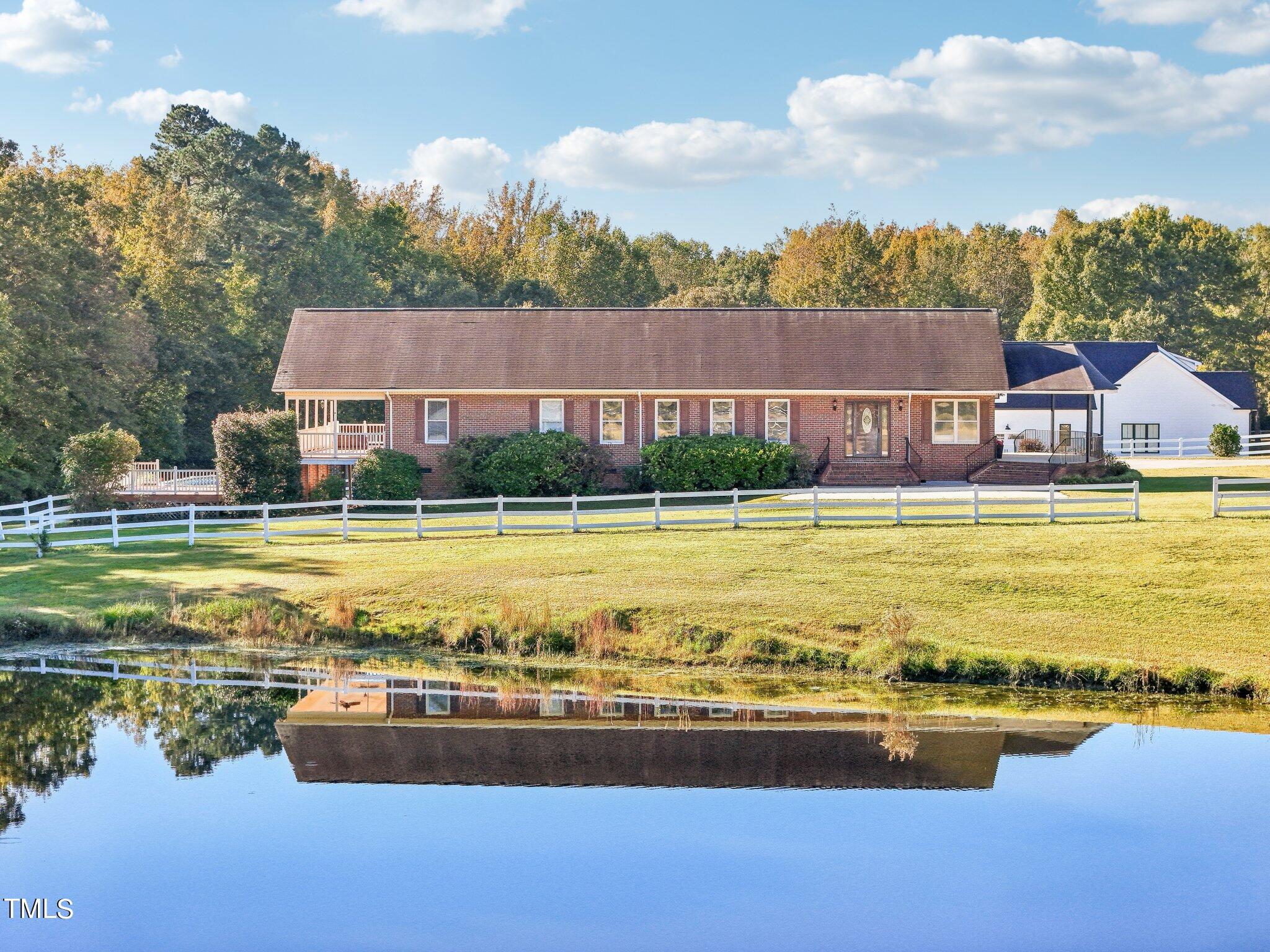 1517 Crickett Road Raleigh, NC 27610 - Photo 2 of 41 a view of a swimming pool with an ocean view