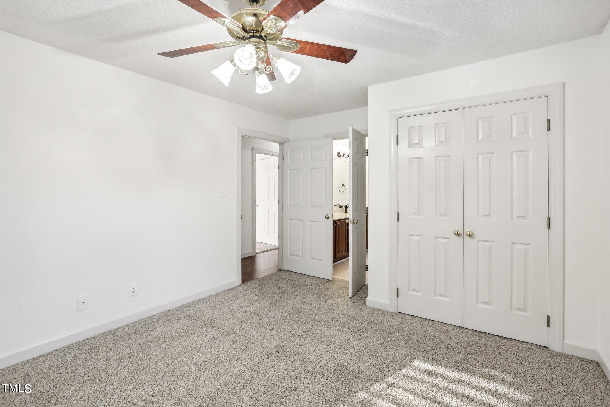 1517 Crickett Road Raleigh, NC 27610 - Photo 21 of 41 a view of a livingroom with a chandelier fan