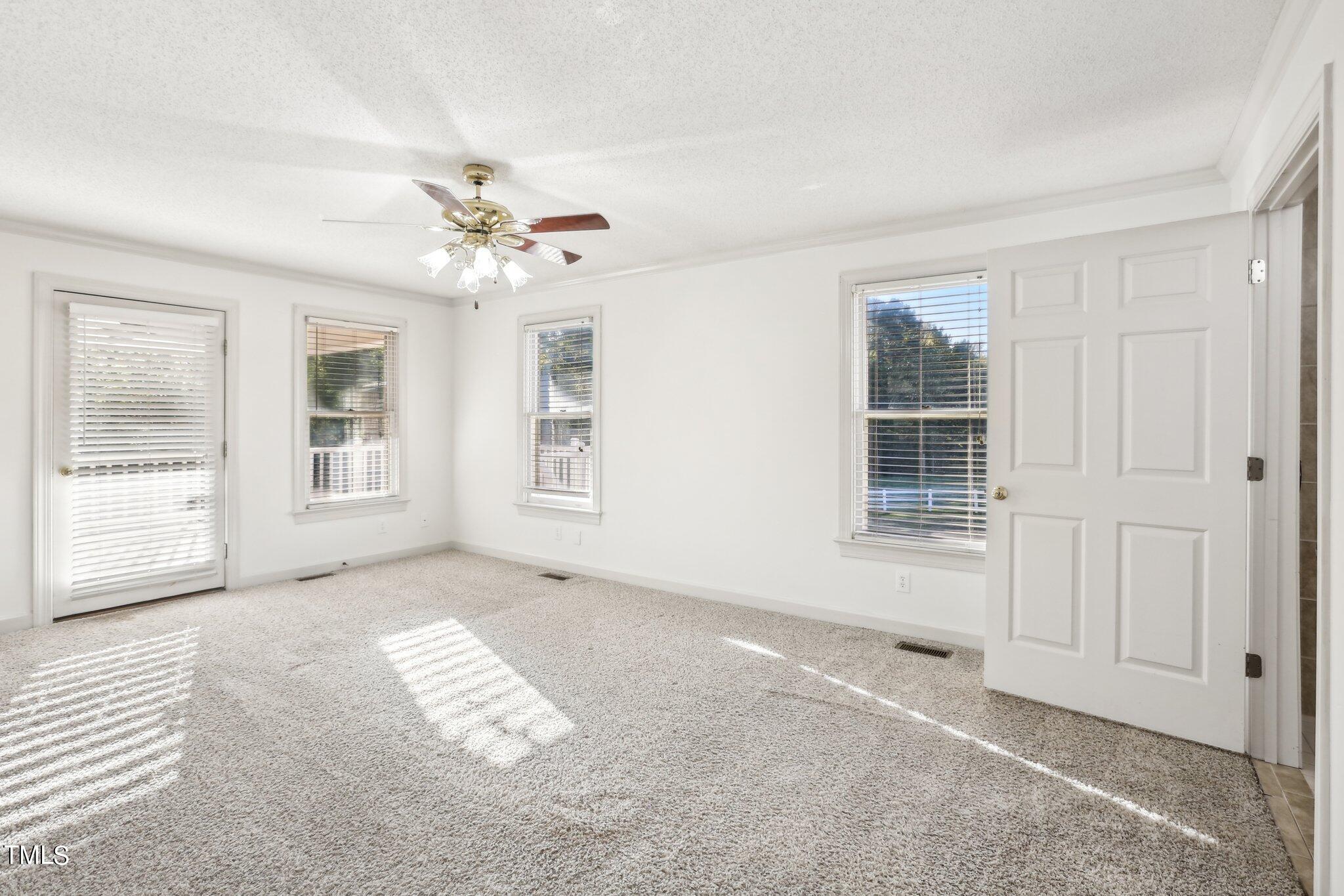 1517 Crickett Road Raleigh, NC 27610 - Photo 22 of 41 a view of an empty room with a window