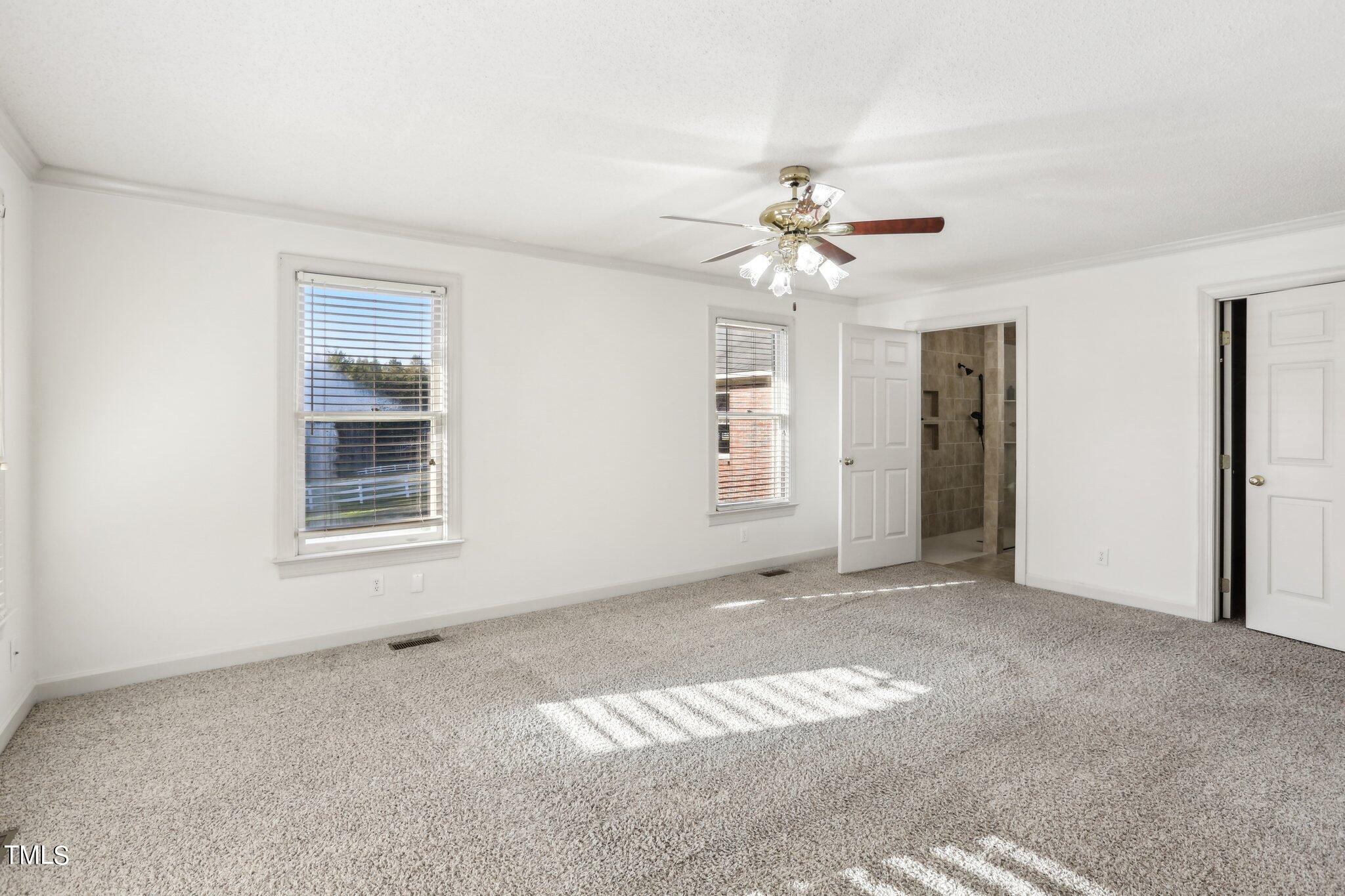 1517 Crickett Road Raleigh, NC 27610 - Photo 25 of 41 wooden floor in an empty room with a window