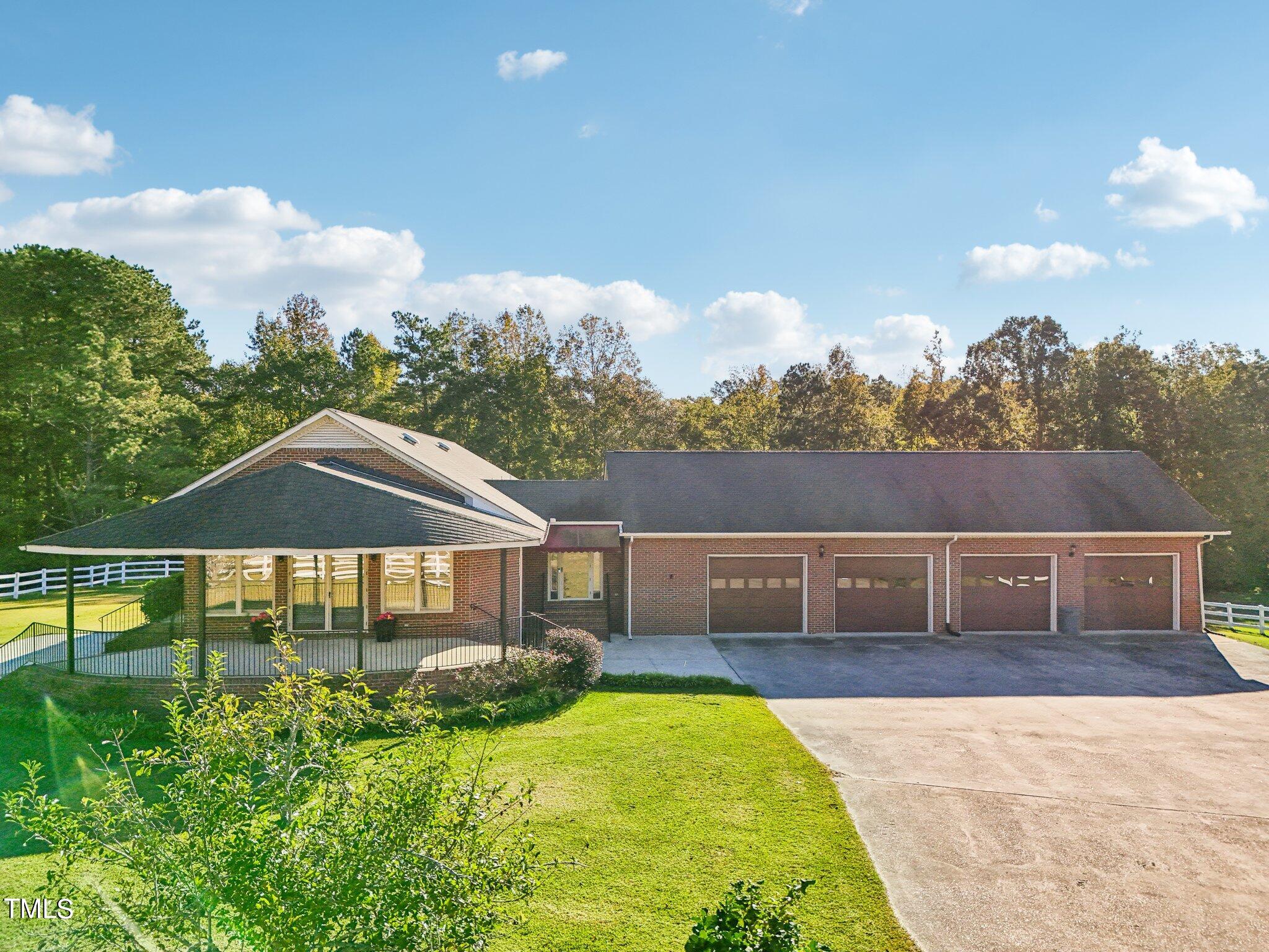 1517 Crickett Road Raleigh, NC 27610 - Photo 5 of 41 a front view of house with yard and green space