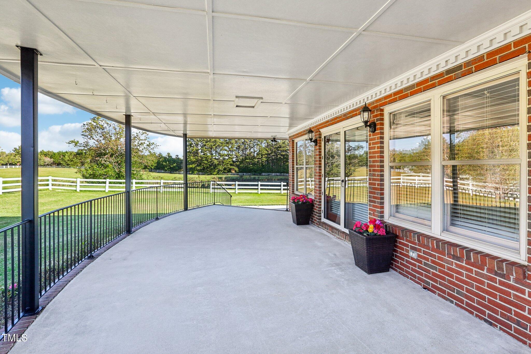 1517 Crickett Road Raleigh, NC 27610 - Photo 6 of 41 a view of a room with floor to ceiling windows and floor to ceiling window