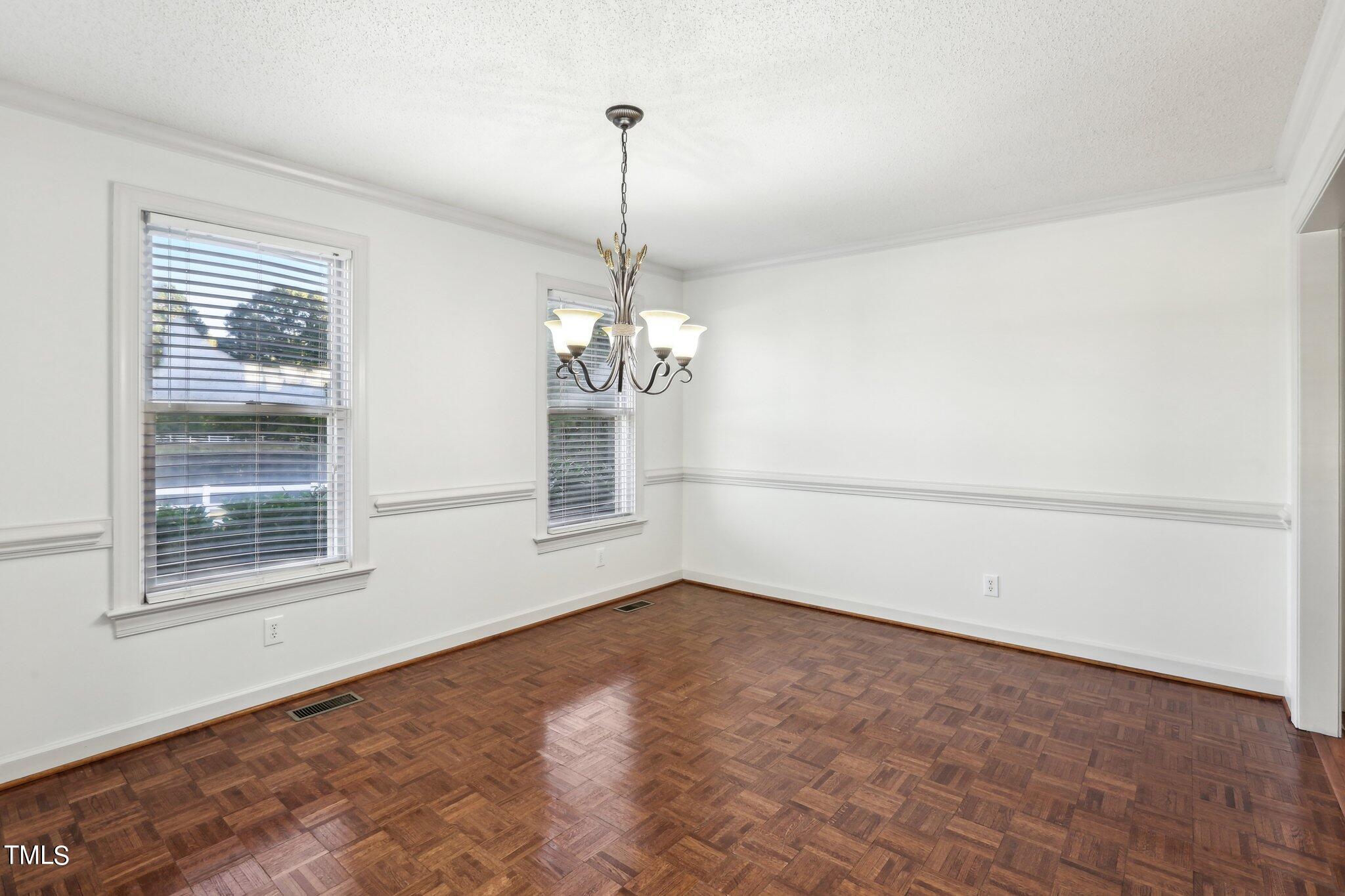 1517 Crickett Road Raleigh, NC 27610 - Photo 9 of 41 a view of empty room with window