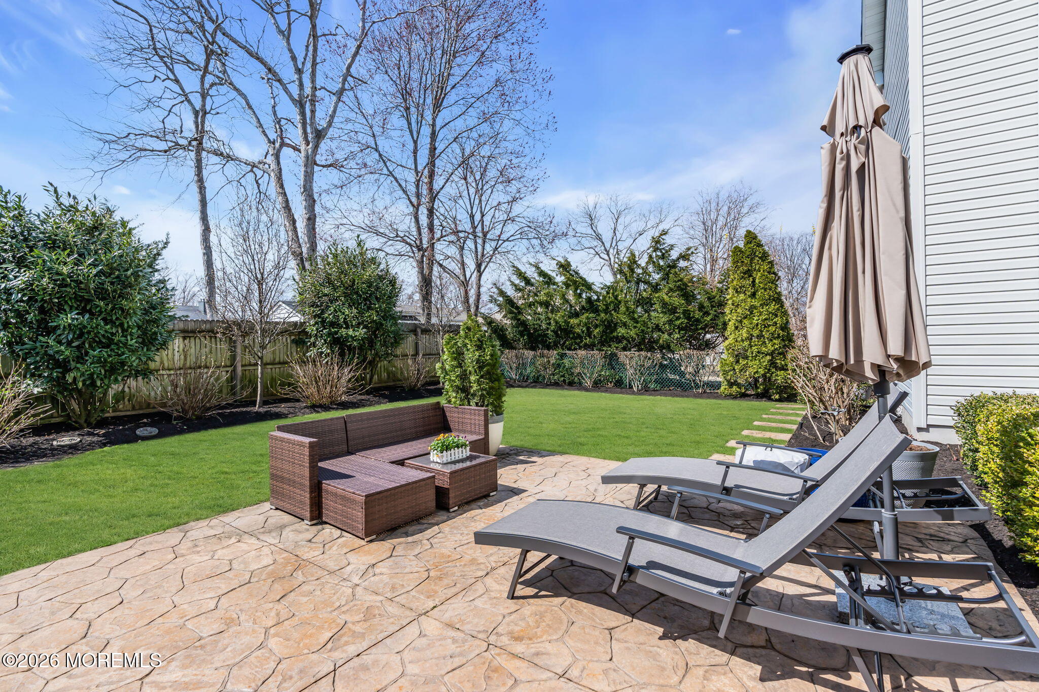 2404 Chestnut Street Point Pleasant, NJ 08742 - Photo 12 of 16 a view of a patio with couches chairs potted plants and a yard