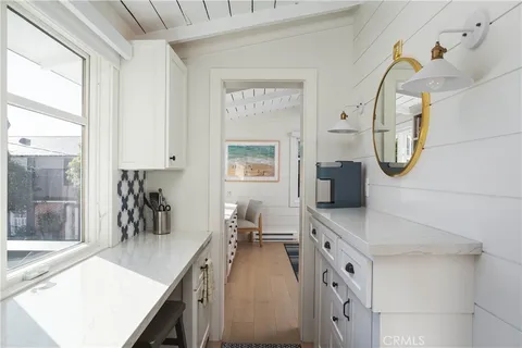 a spacious bathroom with a sink a mirror and a shower