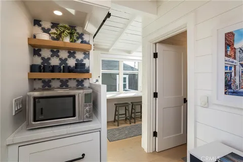 a kitchen with a stove and a microwave