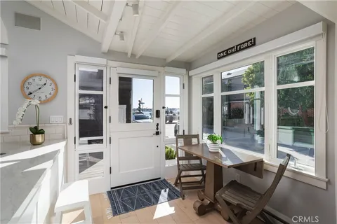 a living room with furniture a window and a chandelier