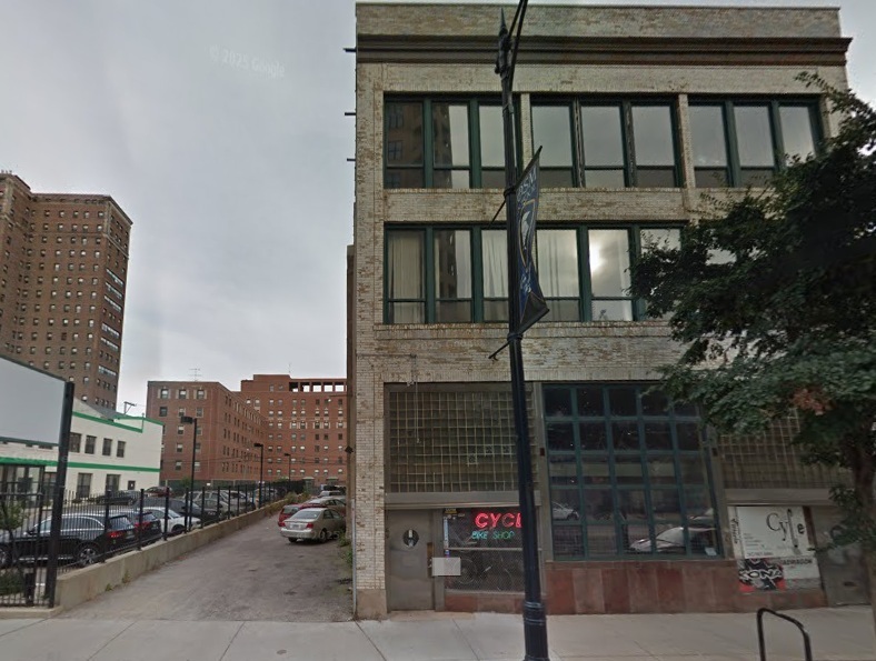 a front view of a house with parking