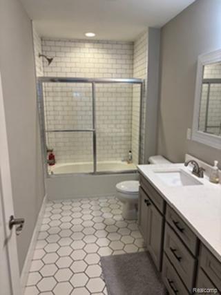 2500 Walnut View Drive Howell, MI 48855 - Photo 40 of 41 Bathroom featuring double vanity, combined bath / shower with glass door, and light tile patterned floors