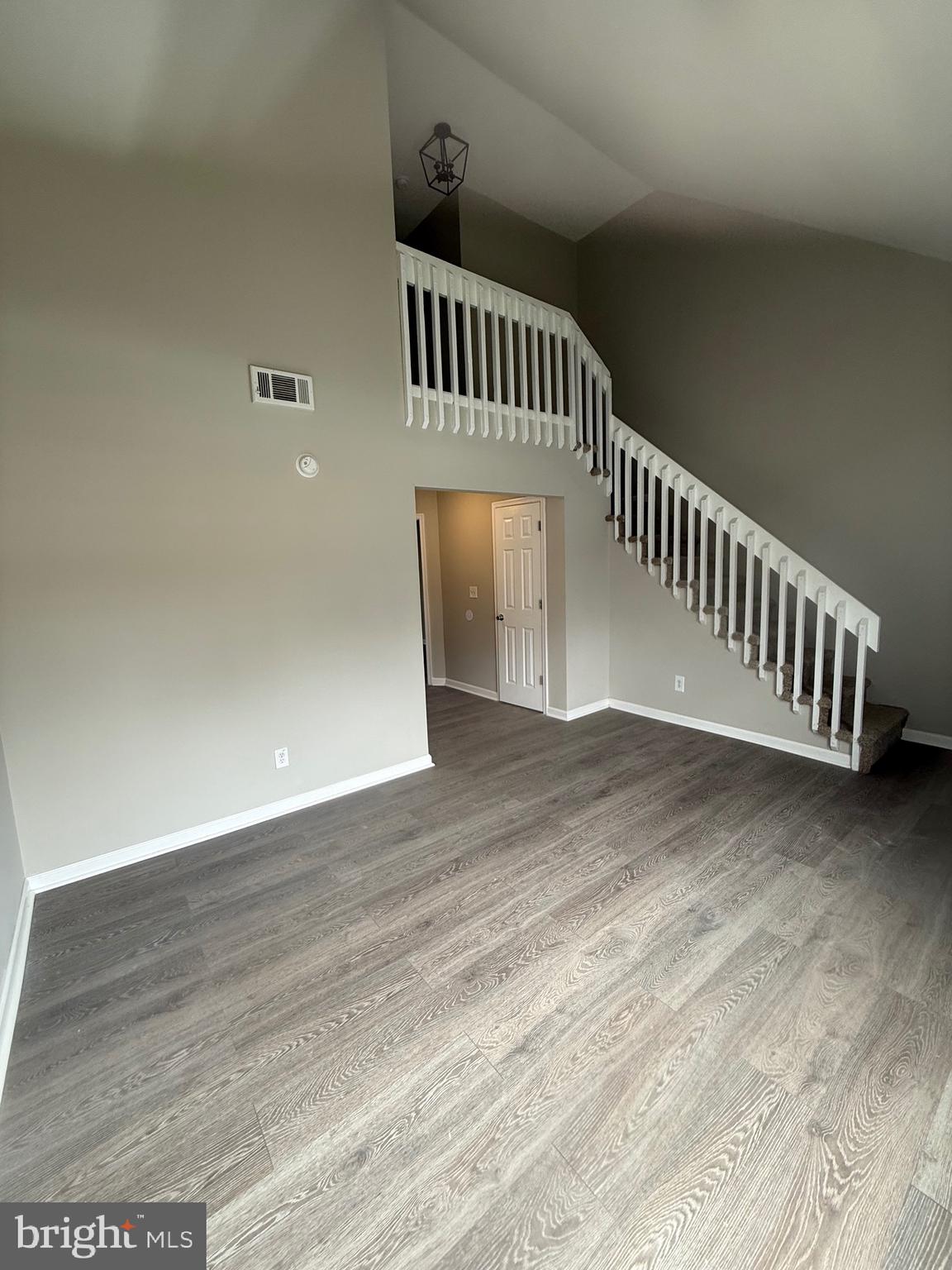 139 Spruance Road Dover, DE 19901 - Photo 3 of 20 a view of a hallway with wooden floor