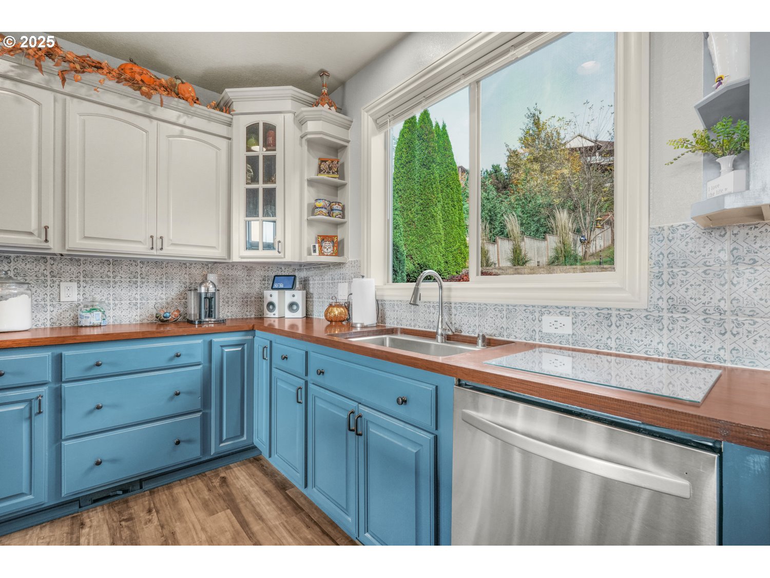 3561 Z Street Washougal, WA 98671 - Photo 12 of 41 a kitchen with stainless steel appliances granite countertop a sink and wooden cabinets