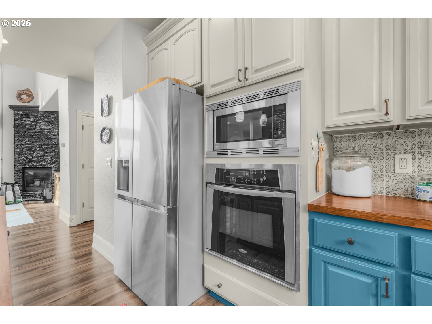 3561 Z Street Washougal, WA 98671 - Photo 13 of 41 a kitchen with stainless steel appliances granite countertop a refrigerator stove and white cabinets