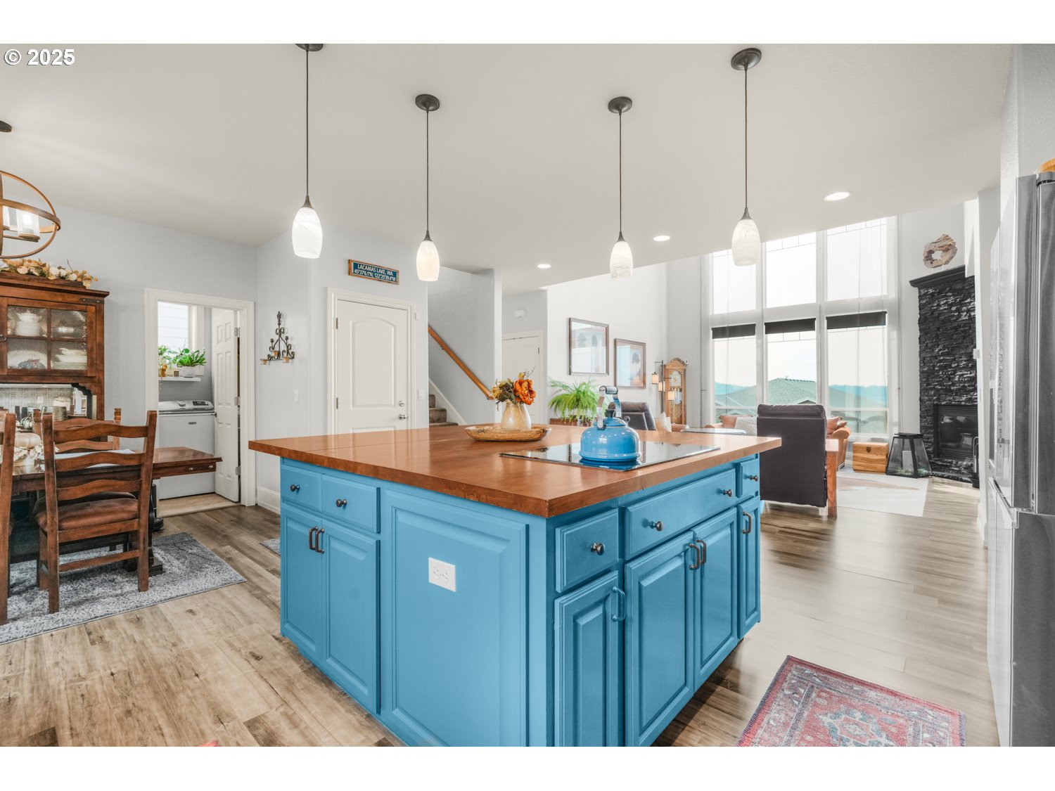 3561 Z Street Washougal, WA 98671 - Photo 14 of 41 a kitchen with stainless steel appliances kitchen island granite countertop a stove a sink and a wooden cabinets