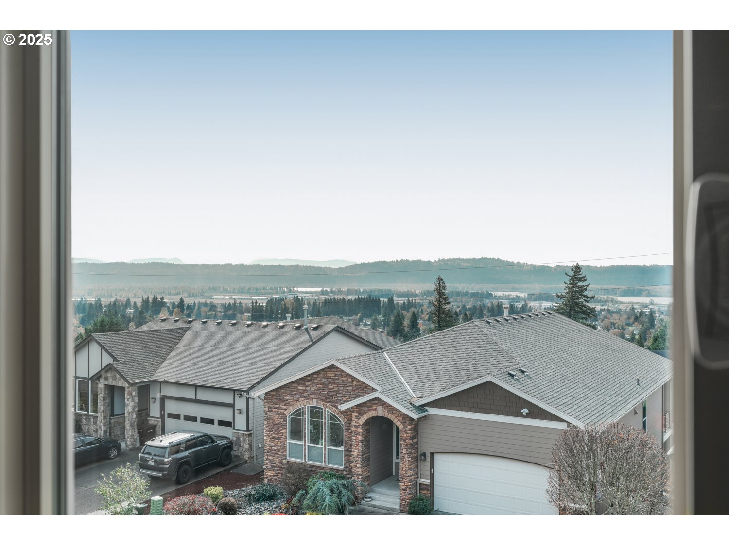 3561 Z Street Washougal, WA 98671 - Photo 8 of 41 a view of a big house with a mountain in the background