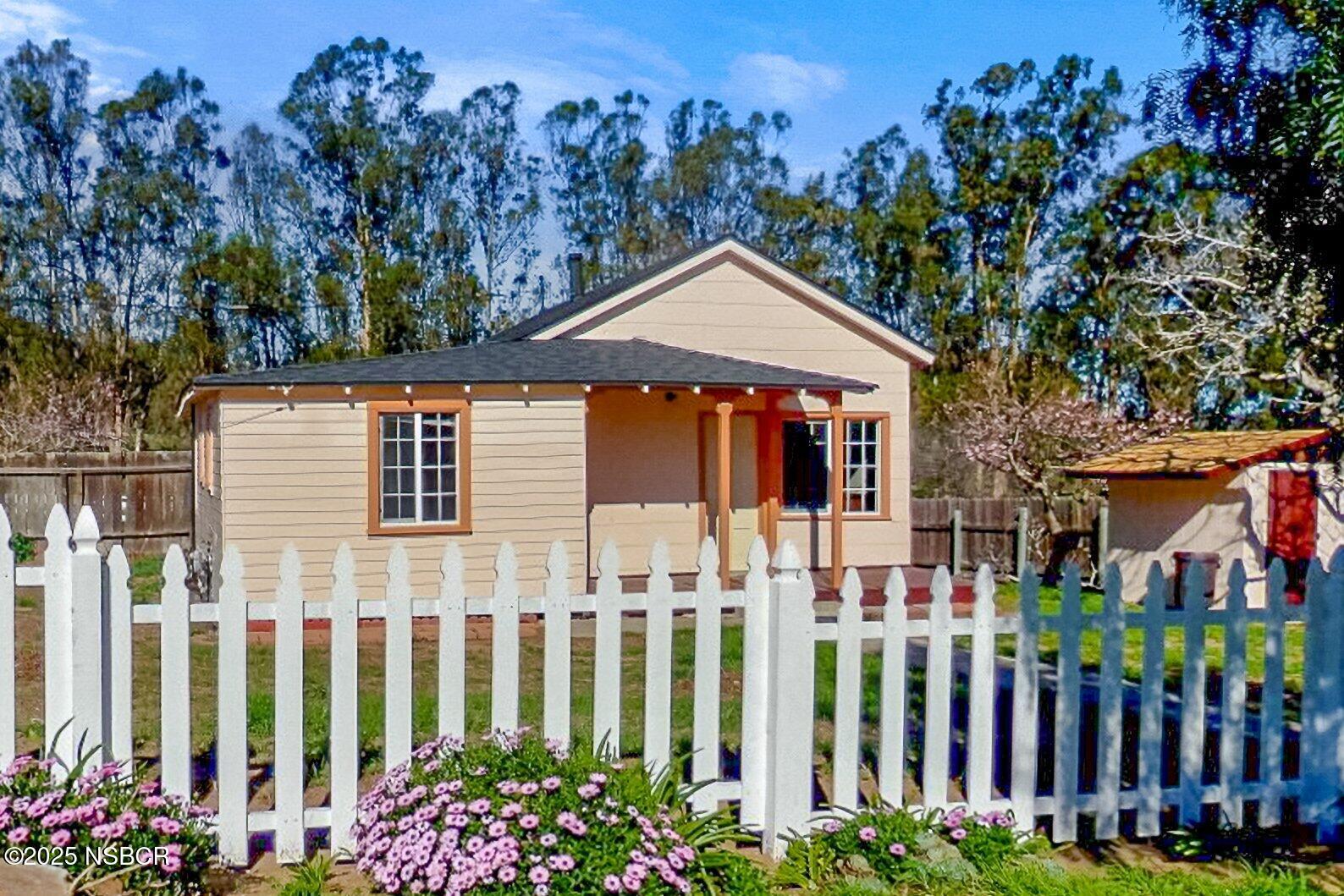 4314 West Ocean Avenue Lompoc, CA 93436 - Photo 40 of 58 a front view of a house with a garden