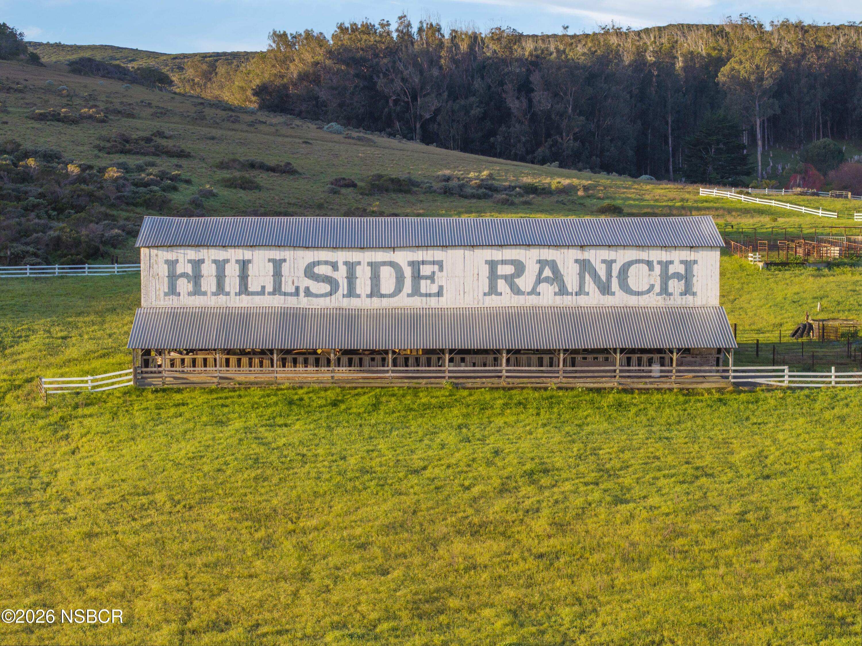 4314 West Ocean Avenue Lompoc, CA 93436 - Photo 10 of 58 a sign that is sitting in front of a tree