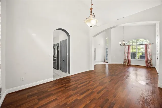 a view of a room with wooden floor and window