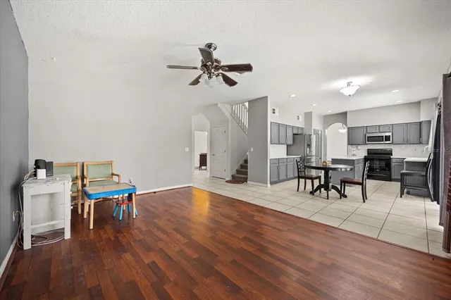 a view of a workspace with furniture and wooden floor