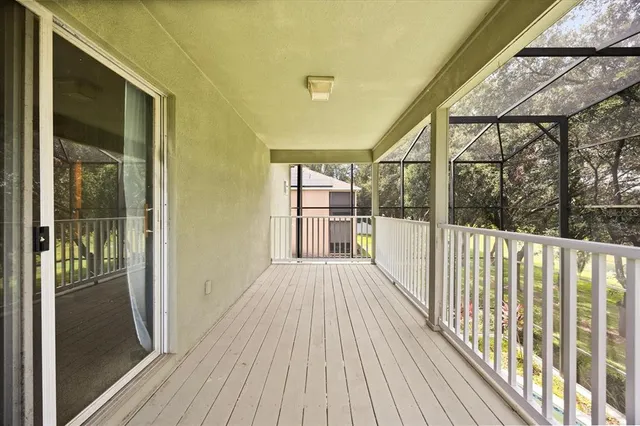 a view of a balcony with wooden floor
