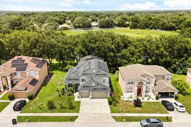 an aerial view of a house with a garden