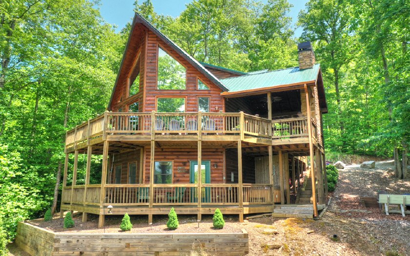139 Trina Lane Blue Ridge, GA 30513 - Photo 1 of 1 a front view of a house with a yard and balcony