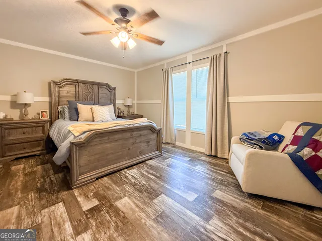 a bedroom with a bed and a couch