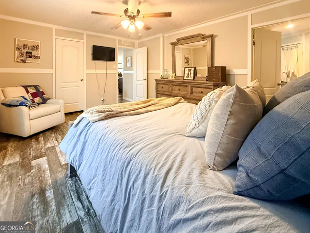 a spacious bedroom with a bed and a couch