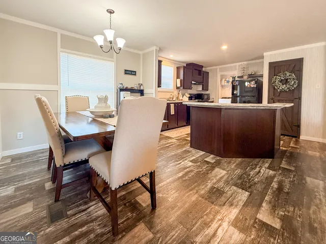 a view of a dining room with furniture and a livingroom