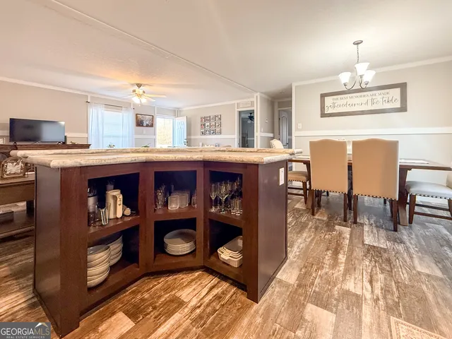 a dining room with furniture and a chandelier