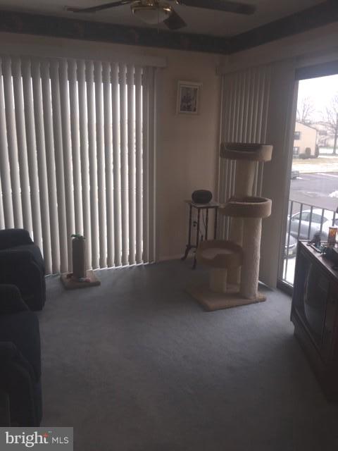 2 Devon Place Sewell, NJ 08080 - Photo 8 of 24 Den with ceiling fan and sliding doors